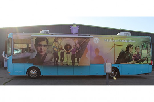 Van with GE #BalanceTheEquation poster on the side