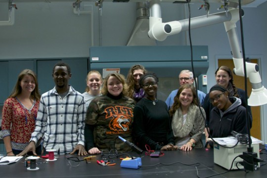 People posing in classroom