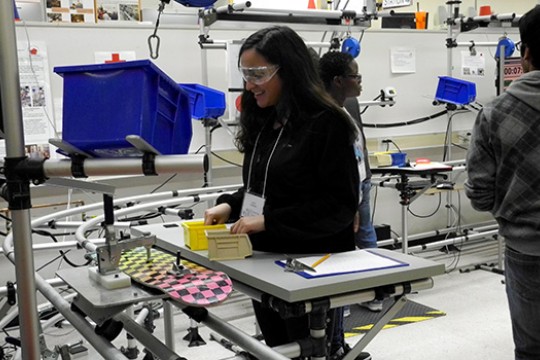 Student working on assembly line