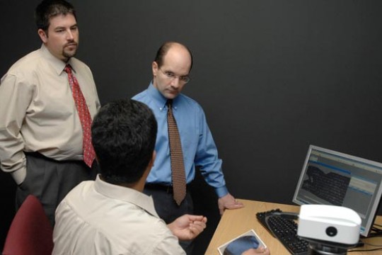 Three people discussing new product