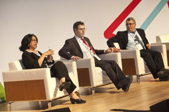 Three People talking on stage 