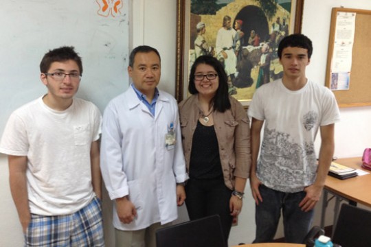 People posing for camera in classroom