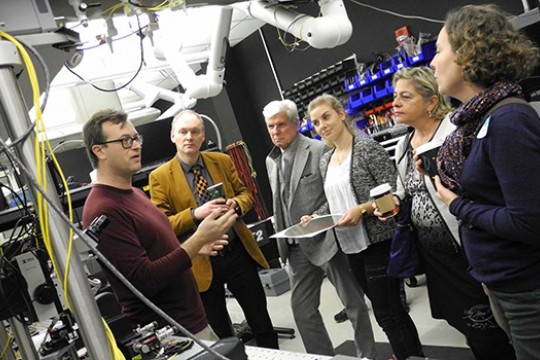 People gathered talking in laboratory