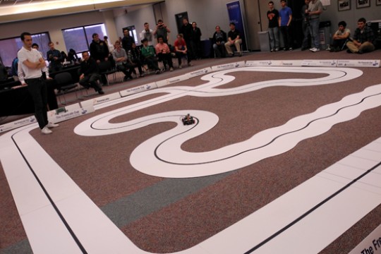 Miniature carts racing on stage