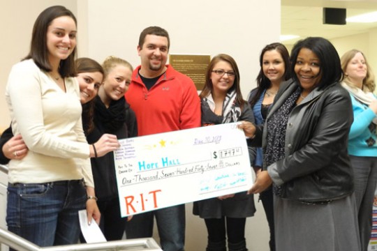 People posing with Check