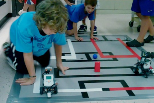 Kids playing with robots
