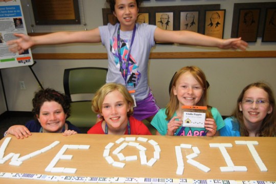 Students posing for camera at event