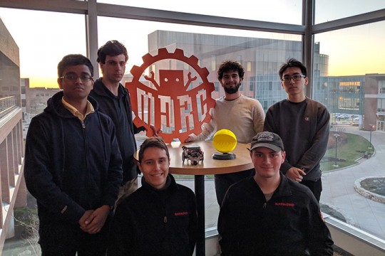 MDRC team members around PacBot trophy