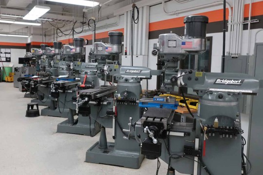 A row of machining tools in a workshop
