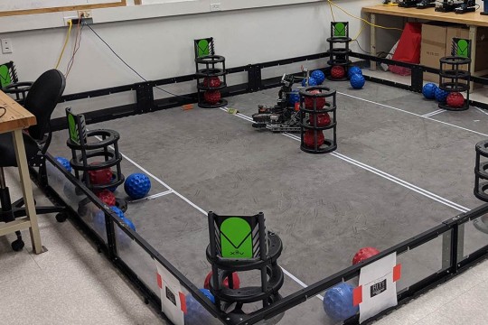 an obstacle course for robots in which it needs to place a ball in a cylindrical container.