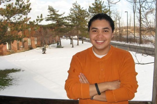 Student standing in front of window