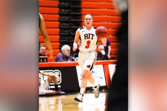 Person dribbling basketball