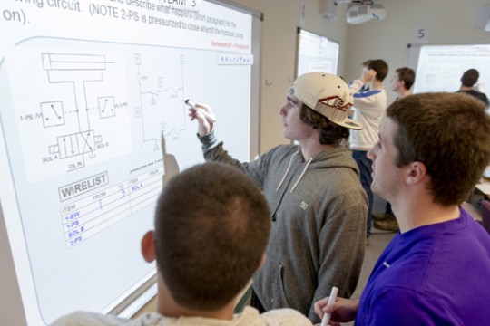 People working on screens 