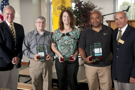 People posing with awards