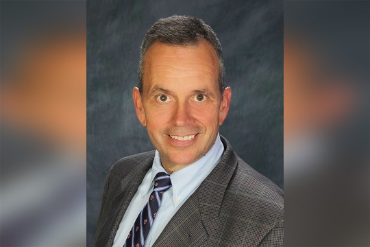 A headshot of Bruce Myers.