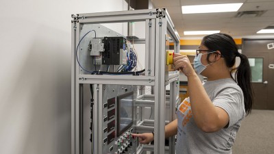 Student working with lab equipment.