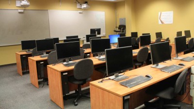 Computer lab with wooden desks