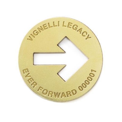 A gold token with a right-facing arrow.