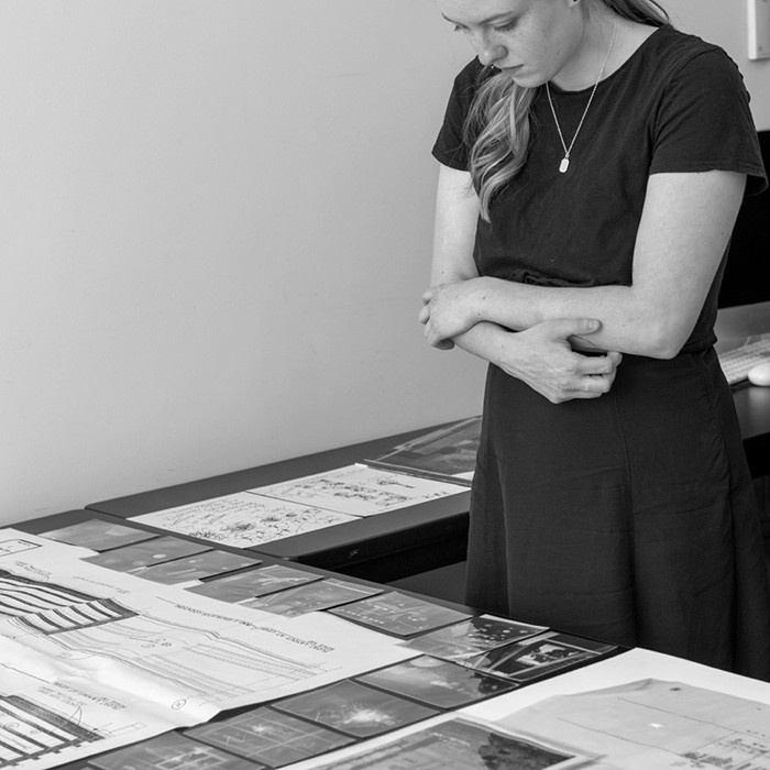 A person looks at Vignelli Center artifacts.
