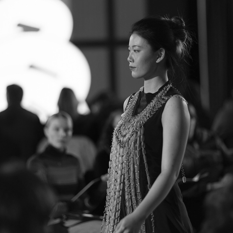 A student walks the runway in a self-designed wearable piece.