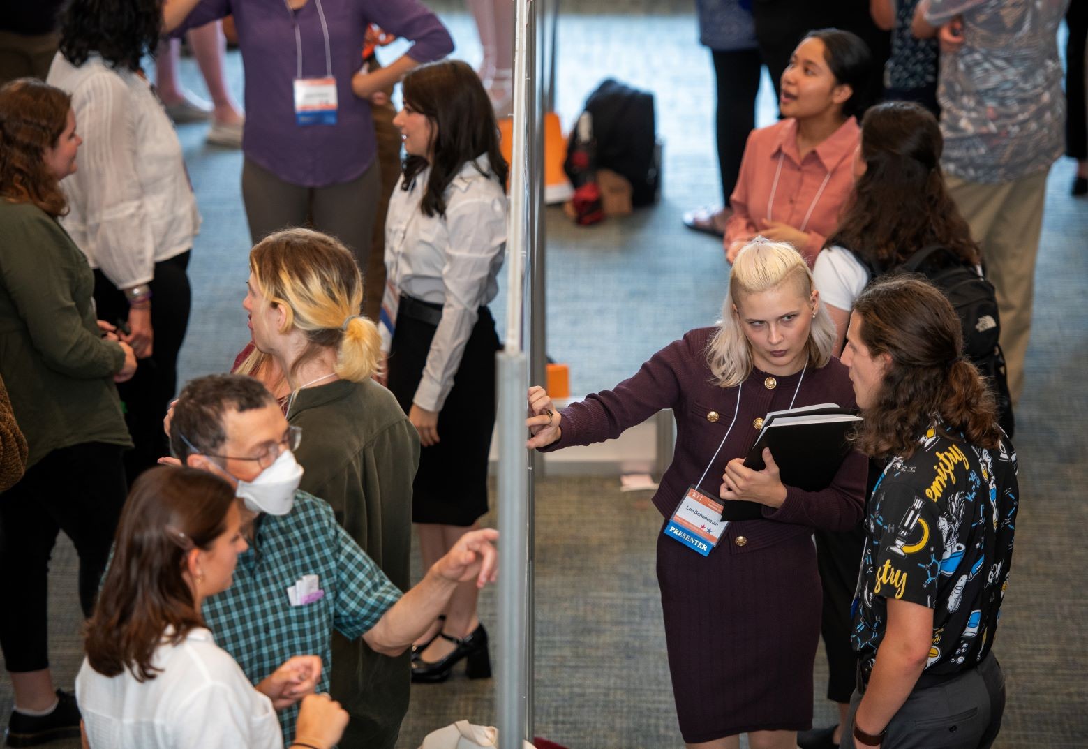 Image of students discussing their research from the 2023 event