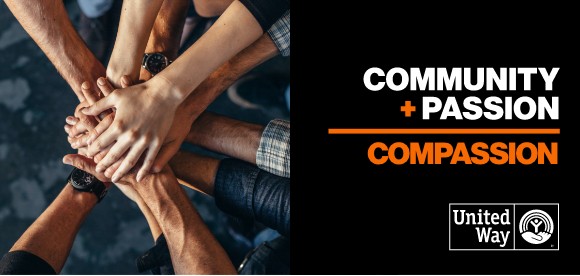 Hands overlapping in huddle. Text States Community + Passion = Compassion