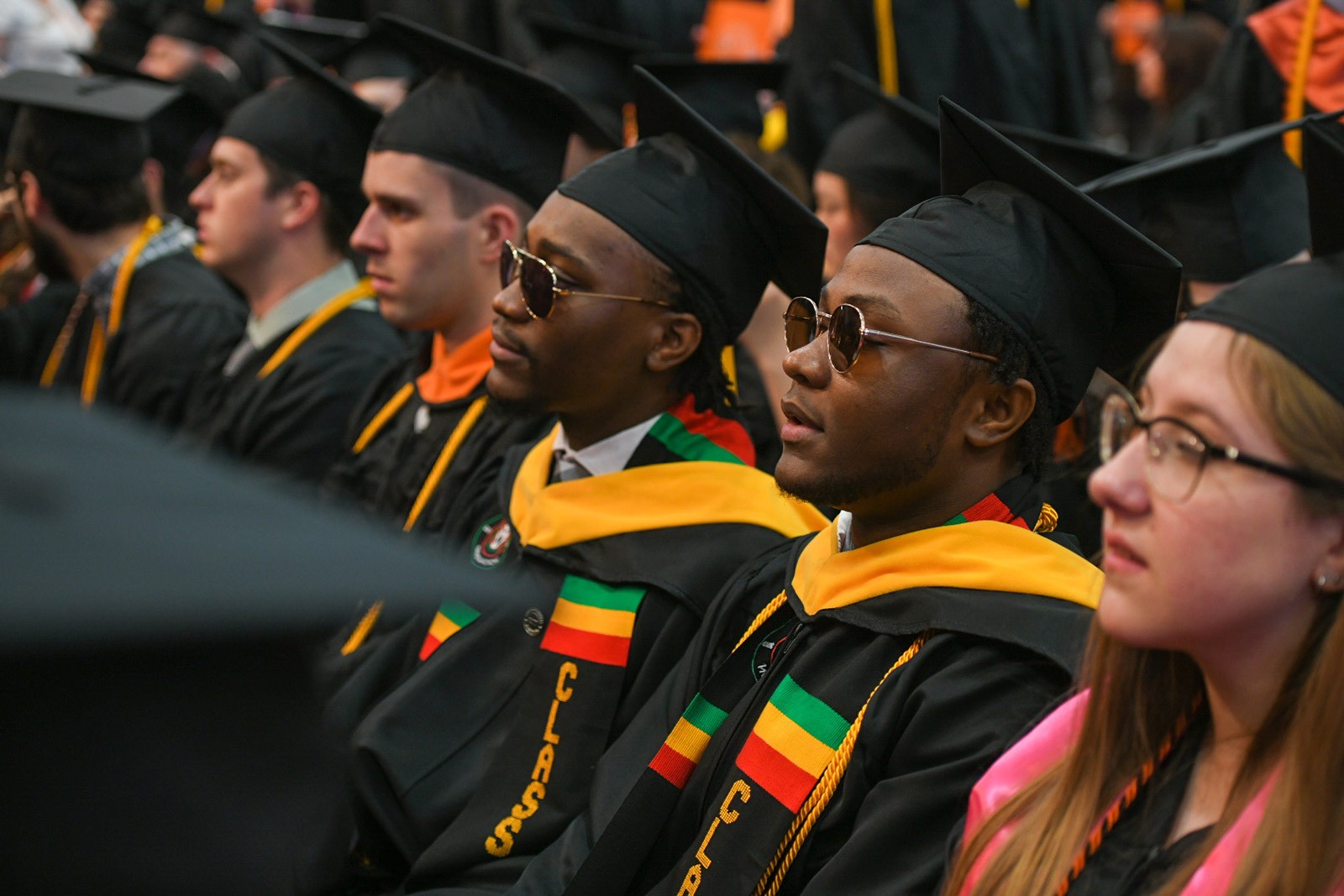RIT graduates sitting and listening
