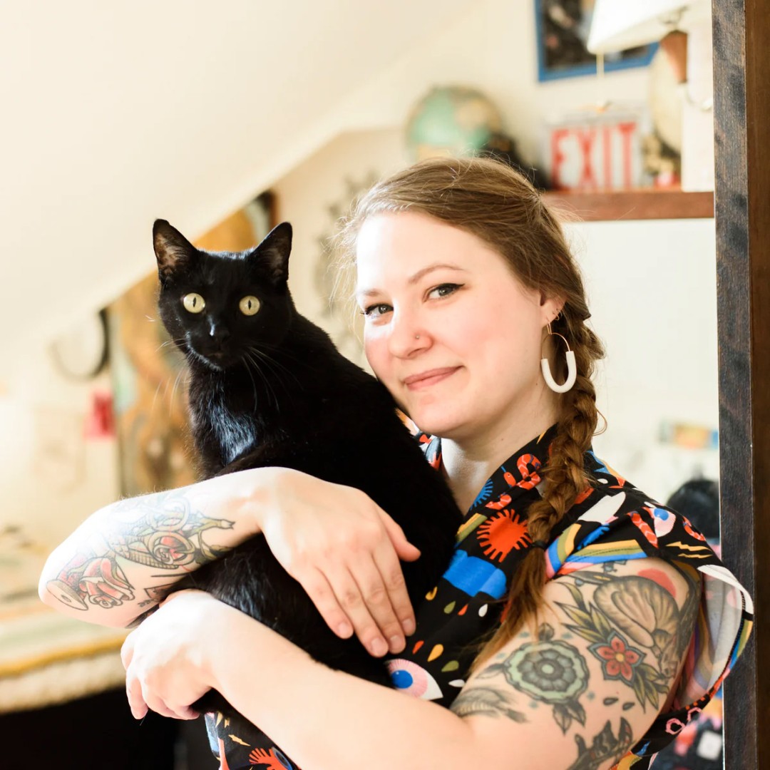 Emily Bellinger holding a cat.