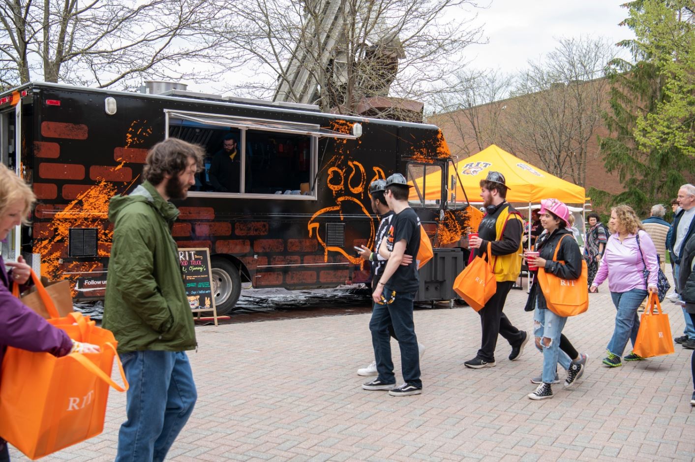 People walking outside the RIT Dining food truck 