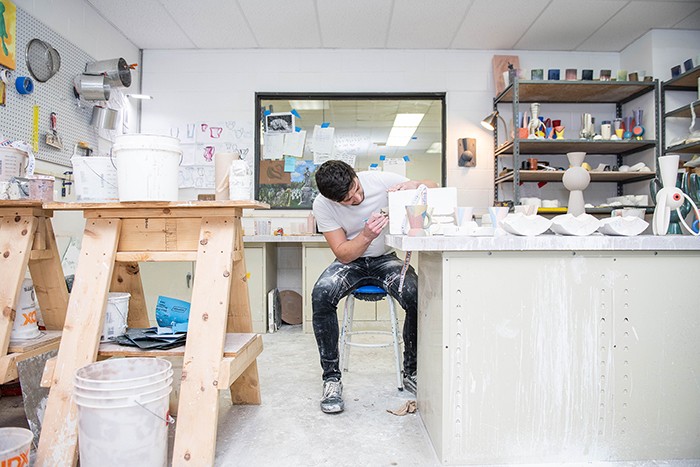 Student Mikey Gambino works in the ceramics studio.