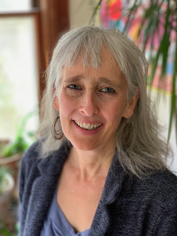 A headshot of Jennifer Torres.