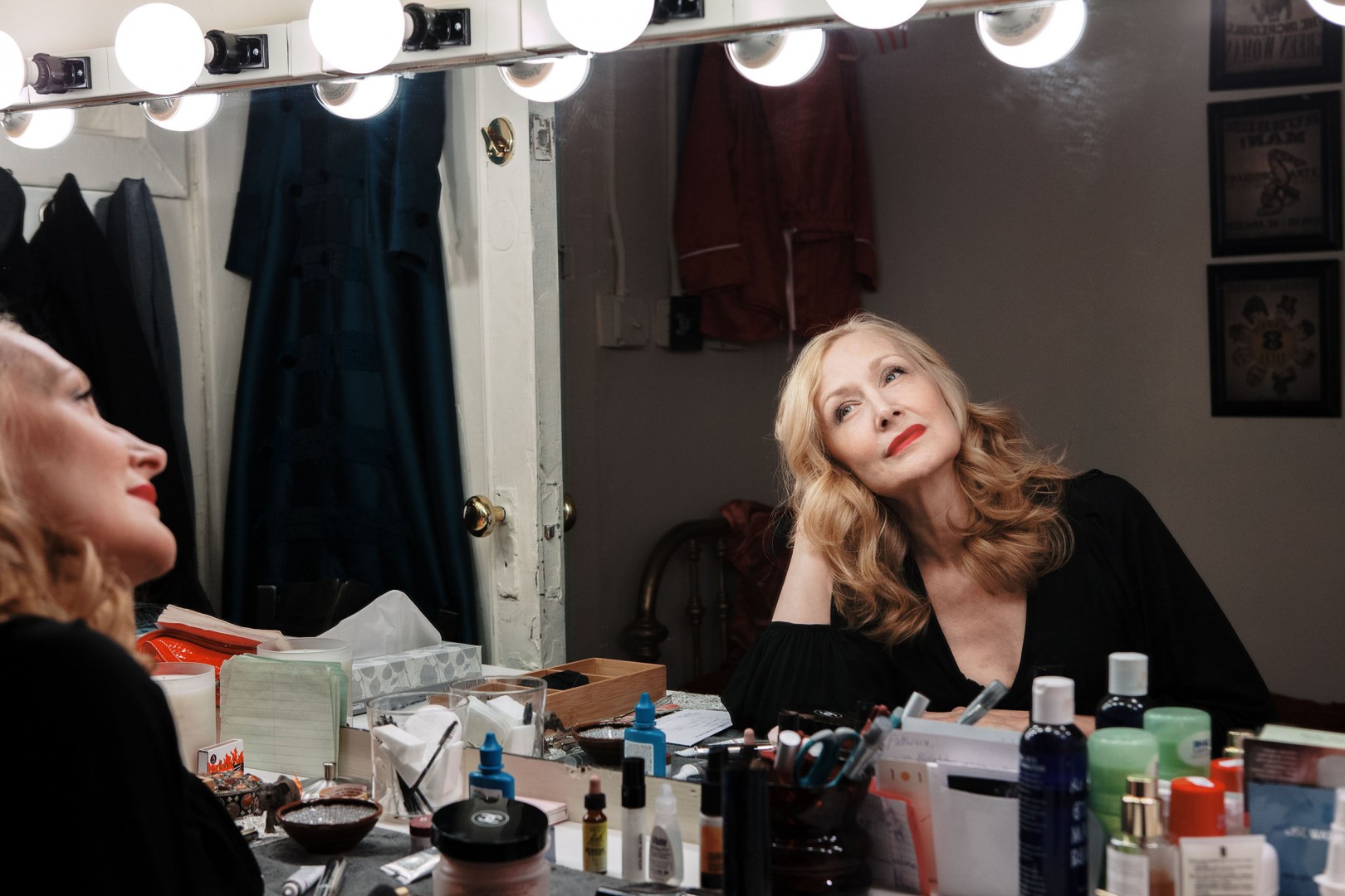 A portrait of Patricia Clarkson, who is staring in the mirror.