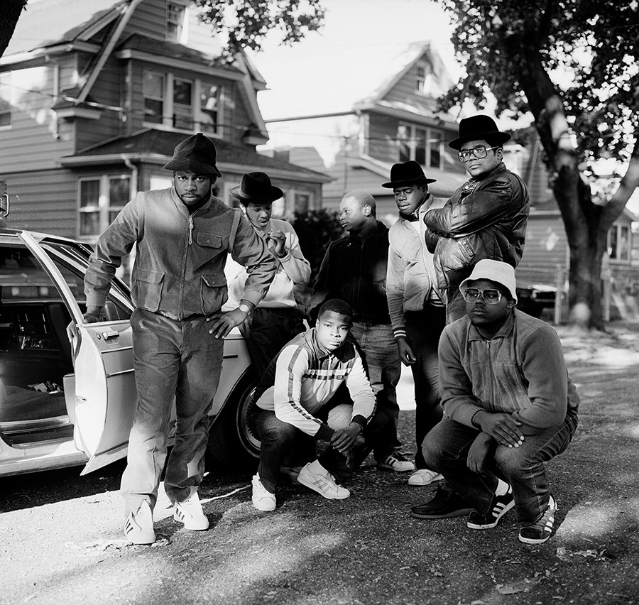 Run DMC and posse pose for a photo.