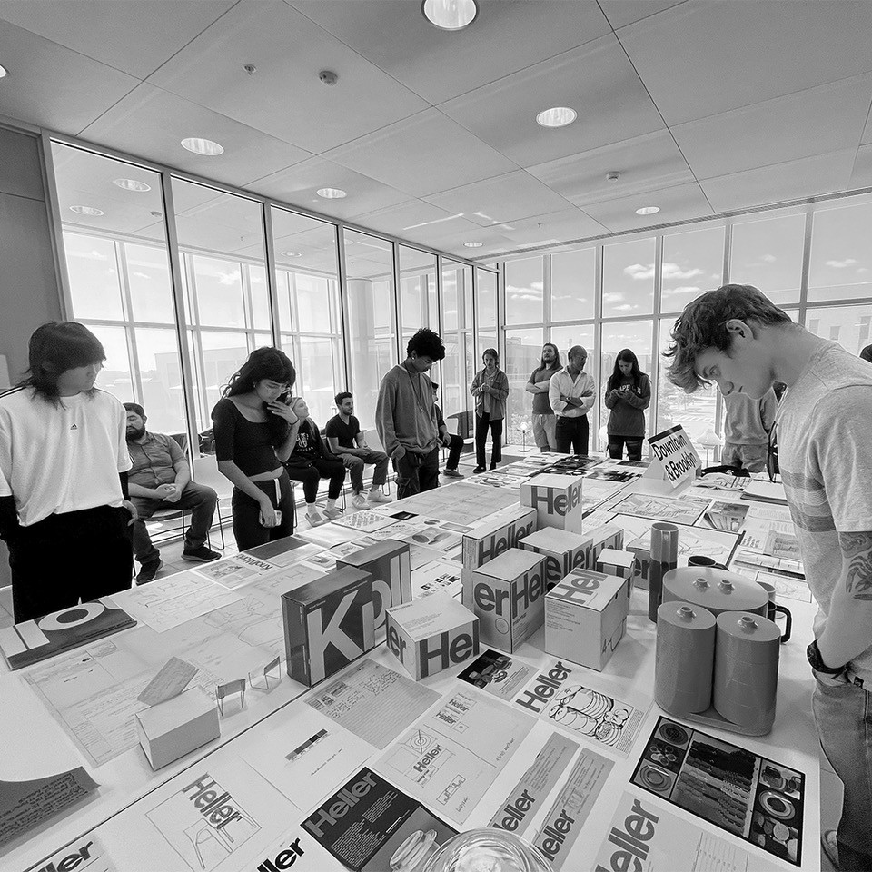 Students look at archive artifacts in the Vignelli Center.