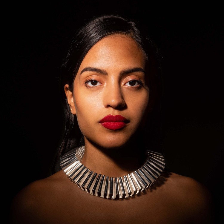 A model wears Vignelli-designed jewelry.