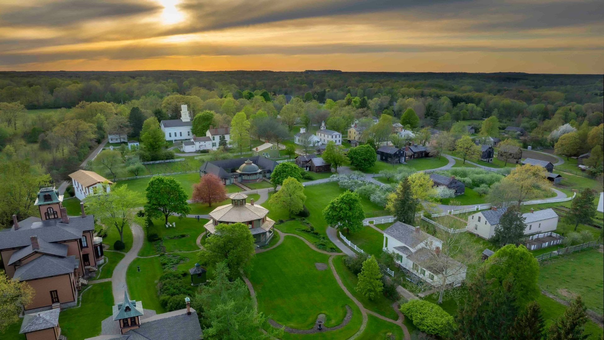 a photo of the genesee country village and museum at sunset