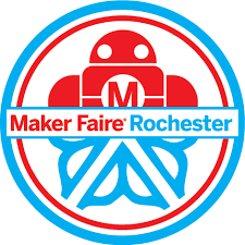 Logo for Maker Faire Rochester. It features a red robot with a white letter “M” on its chest, inside a red and blue circular badge. The words “Maker Faire” are in red and “Rochester” is in blue across the center.