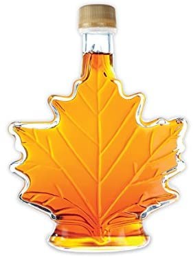 Image of a full maple leaf-shaped bottle of maple syrup.