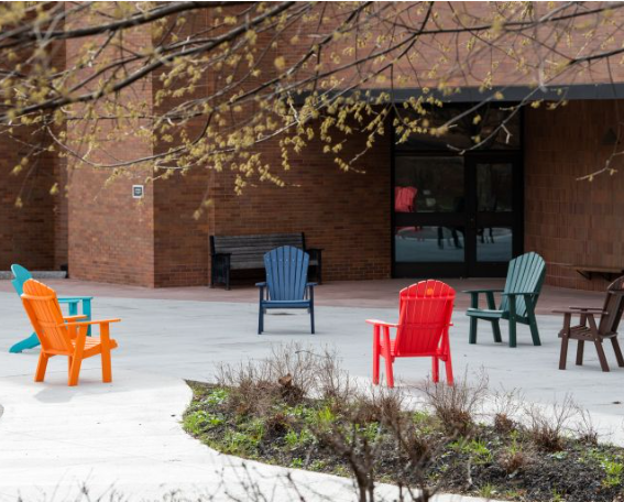 colorful chairs outside campus building