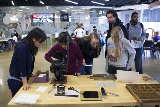 Students viewing various typographic displays