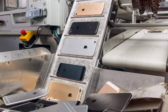 Iphones on converyor belt.