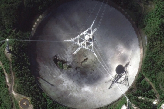 damaged radio telescope at the Arecibo Observatory in Puerto Rico.