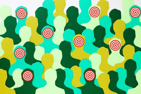 graphic of multi-colored cutouts of people, some of whom have bulls-eyes on their faces.