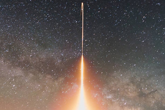 Time-lapse photograph of a rocket launch.
