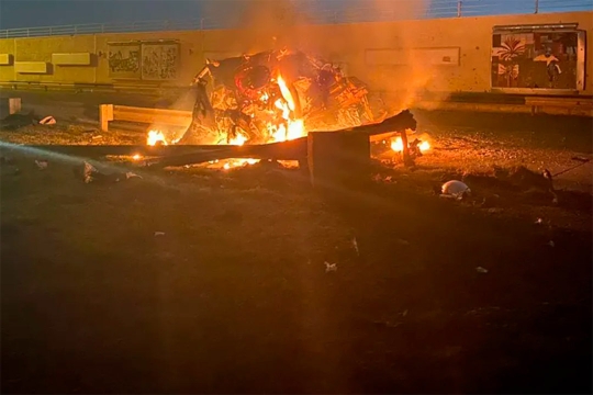 a fire in a street after a drone strike.