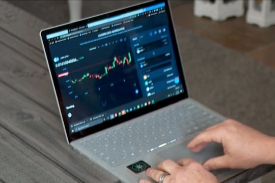 person typing on a laptop.