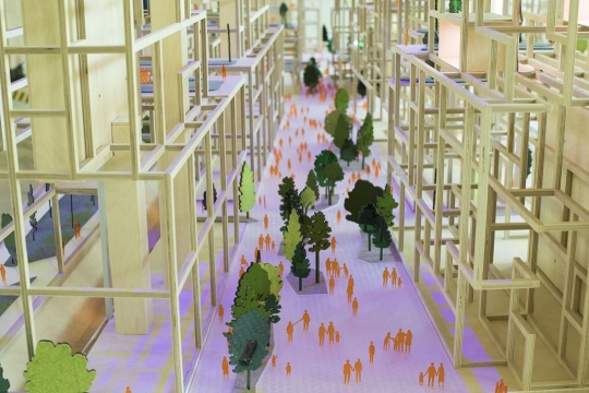 graphic illustration of city buildings and trees and people walking in the street.
