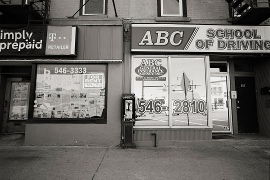 a payphone outside of the ABC School of Driving.