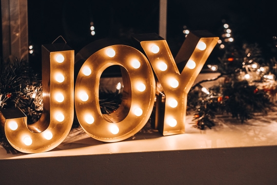 lighted letters that spell joy.