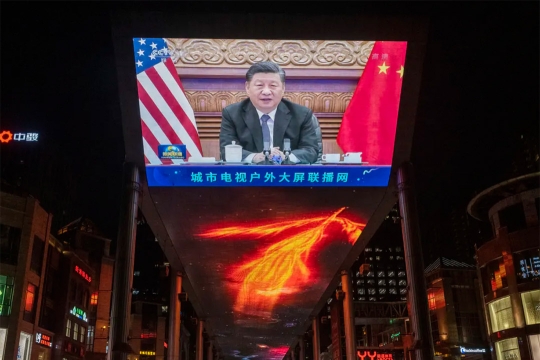 giant TV screen ourdoors showing the president of China.
